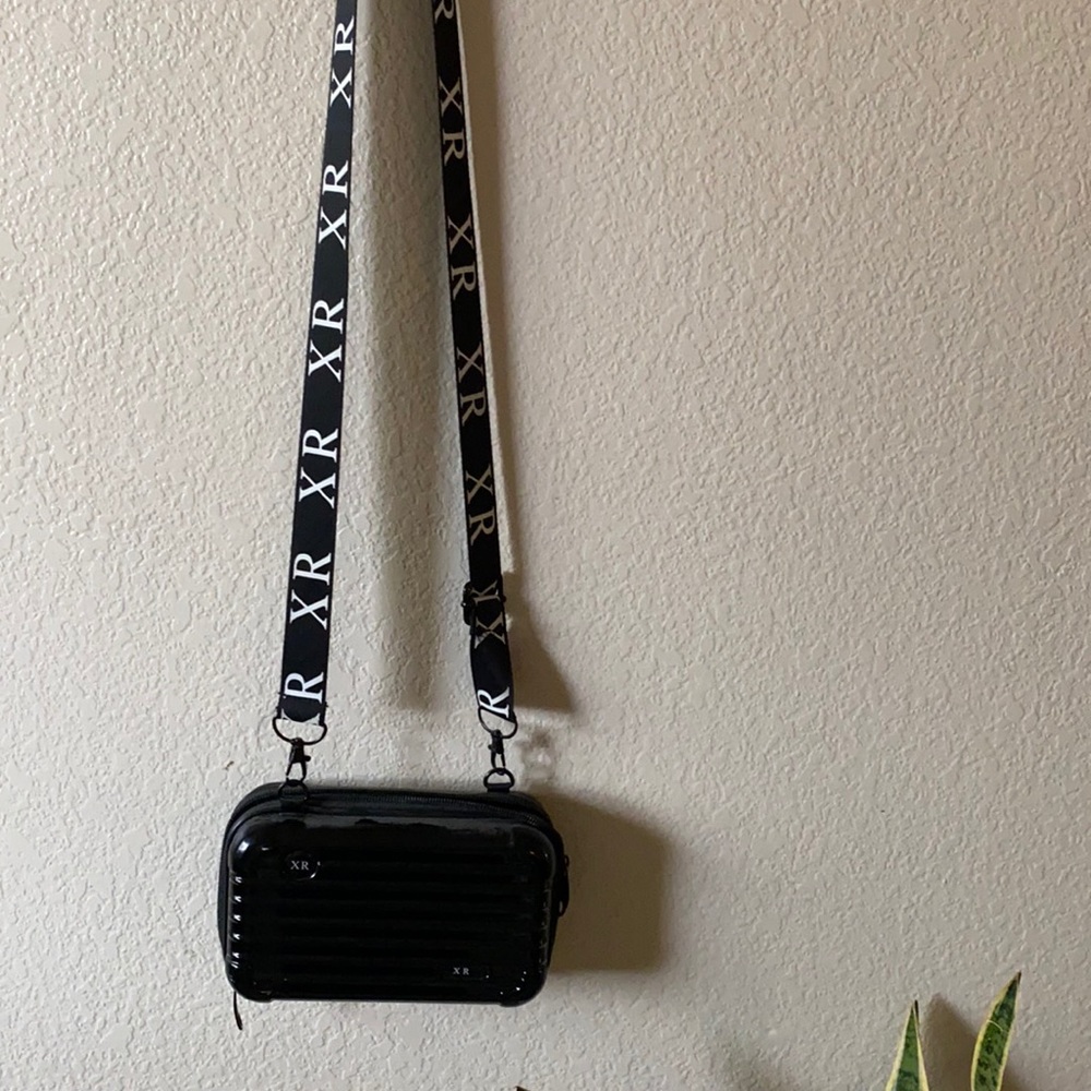 Crossbody bag, mini suitcase.